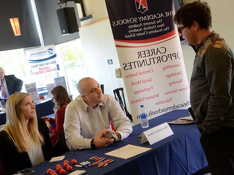 Employers and students meeting during a career fair